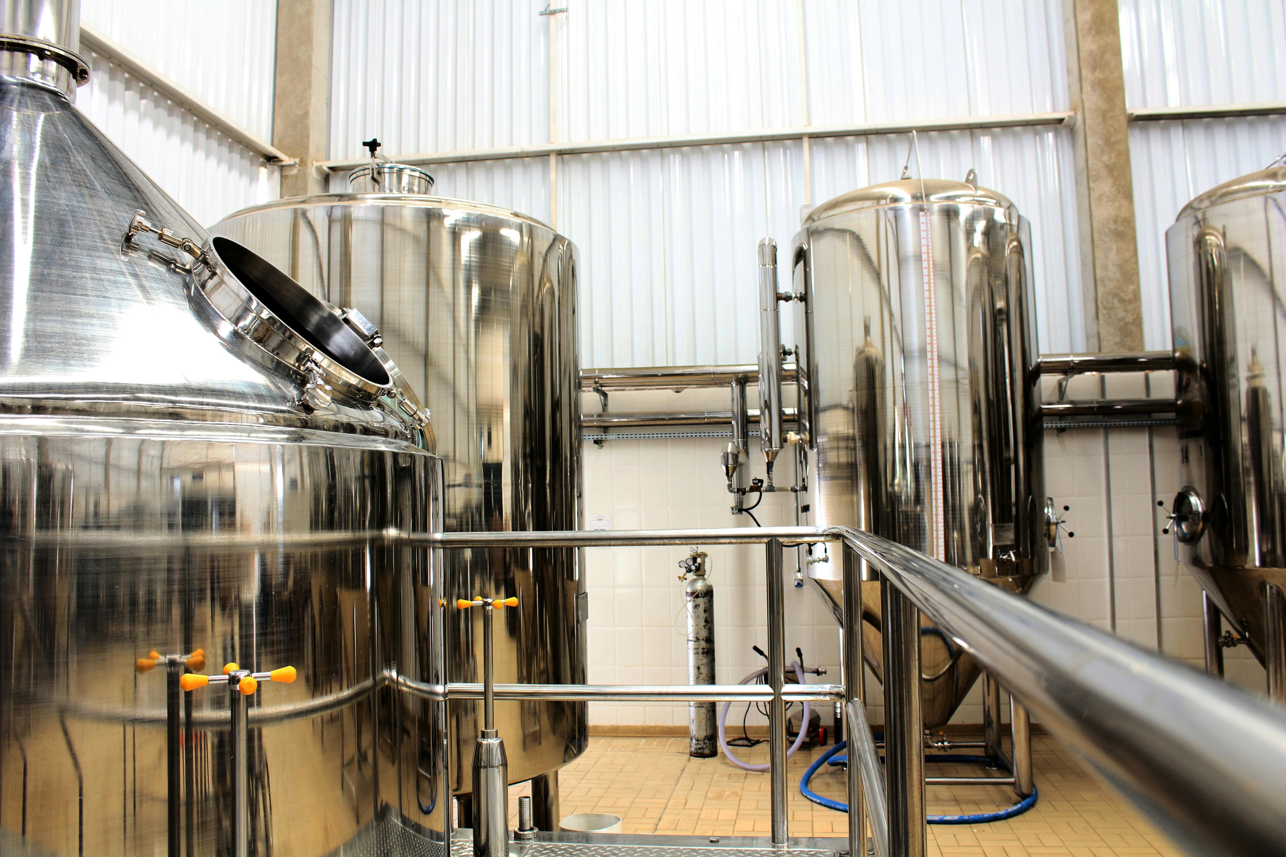 Brewhouse interior with stainless steel fermentation tanks